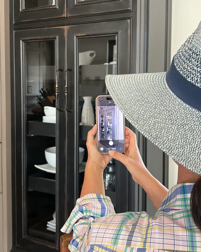 Kristina photographs a black glass-front cabinet with Co|See Studio, to try it in other colors.